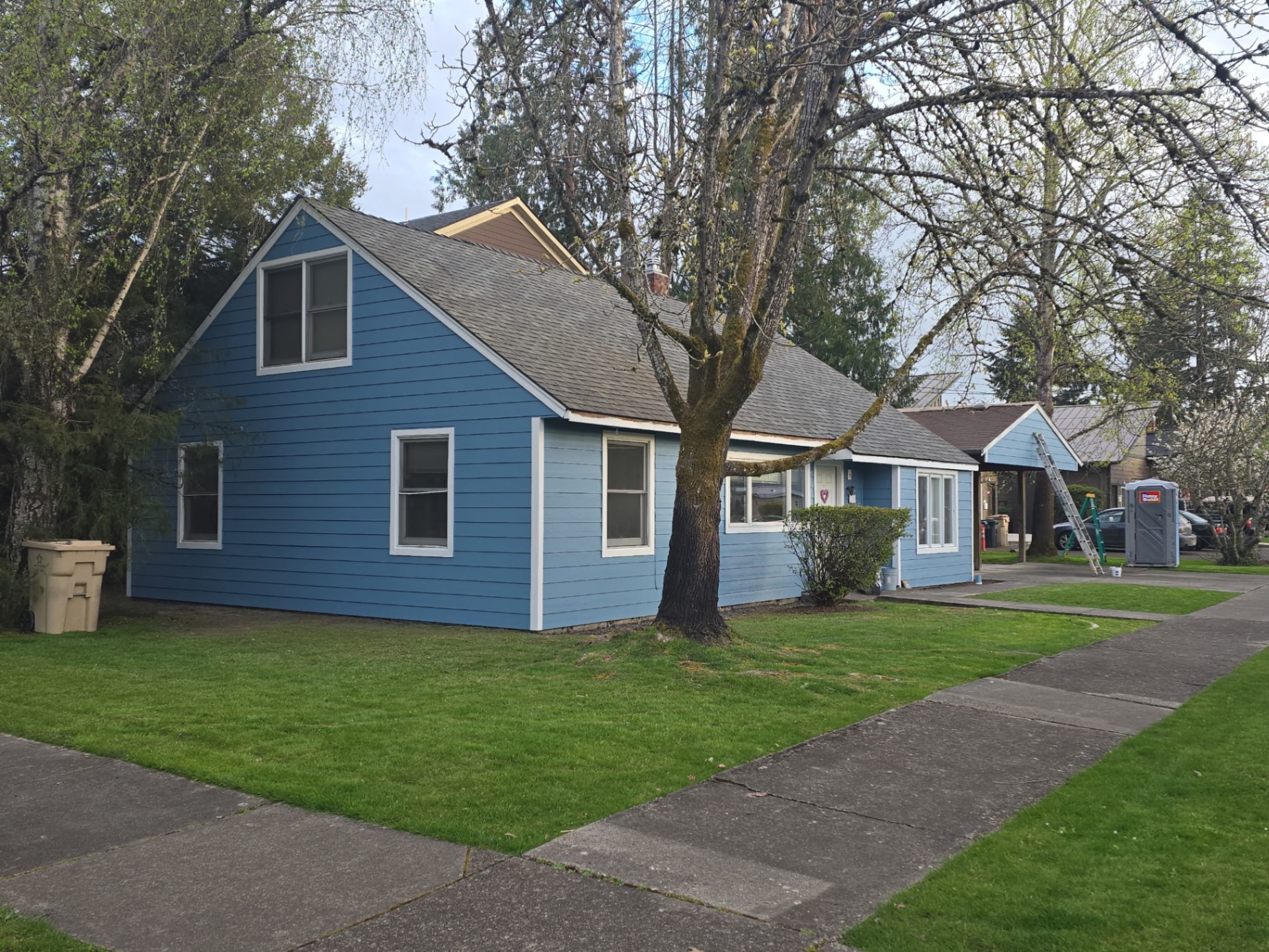 HardiePlank® fiber cement siding installation in progress — blue exterior