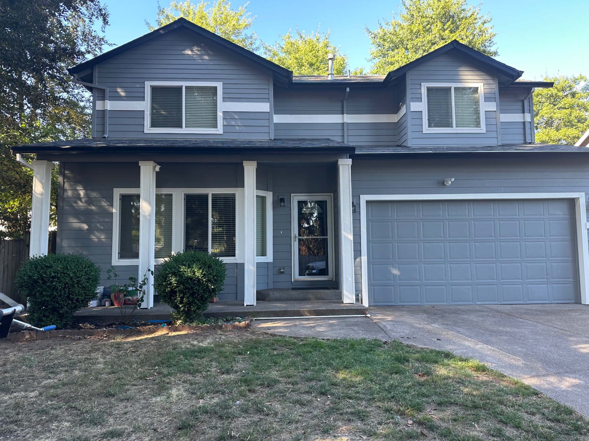 Exterior painting — gray two-story home Salem Oregon — Firu Construction