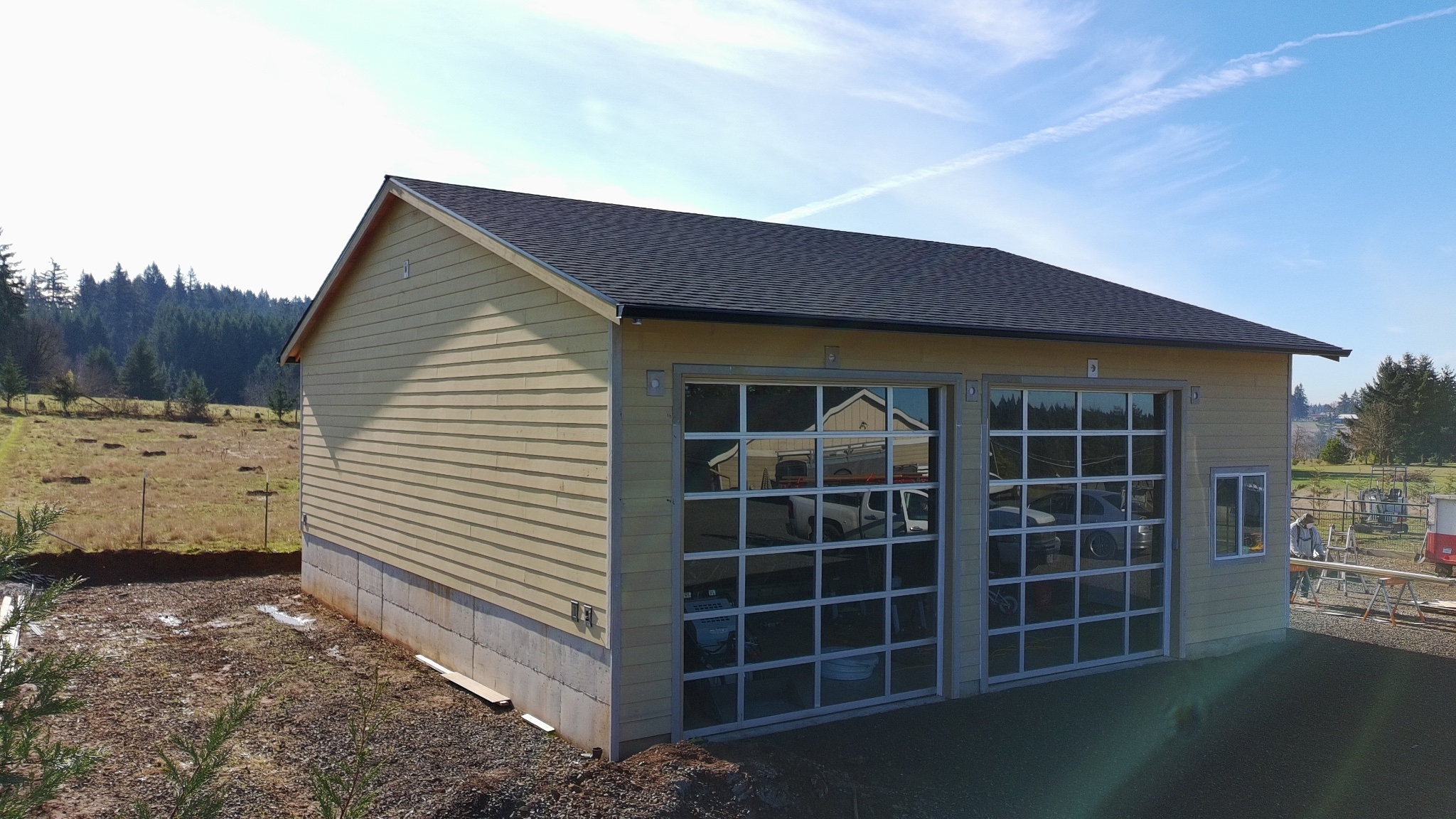 Aerial drone view of completed shingle roof replacement — Firu Construction